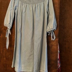 Denim dress. On or off shoulder. Never worn. Tags on